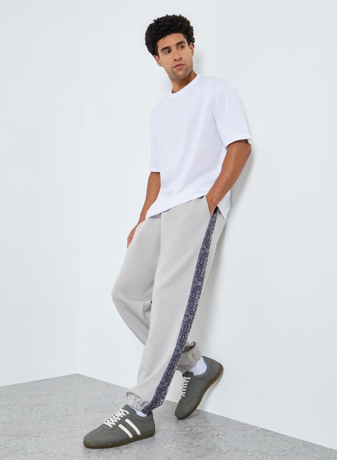 Styli Men Grey Joggers with Printed Side Panel - Image 1